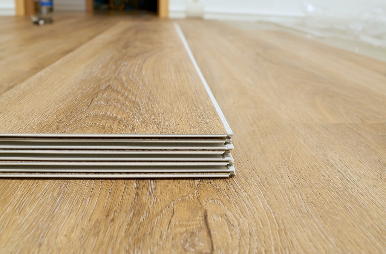 Click-lock flooring being installed